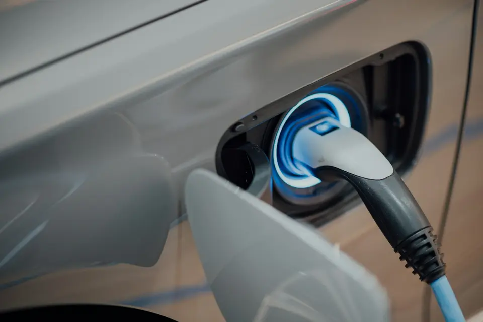EV charging connector plugged into a car charge port