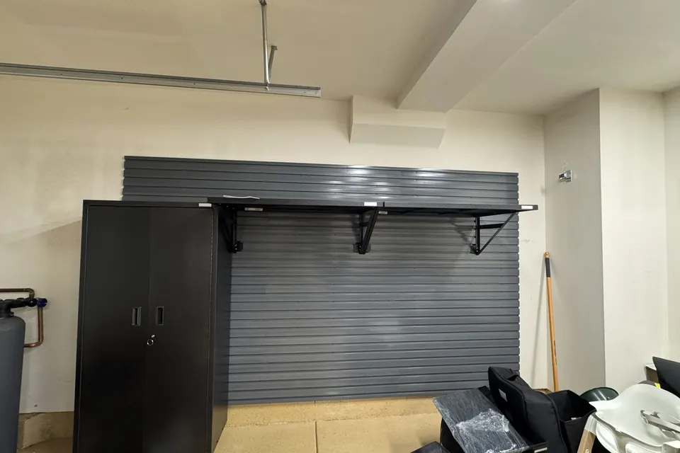 Garage slatwall organizer with shelf brackets installed