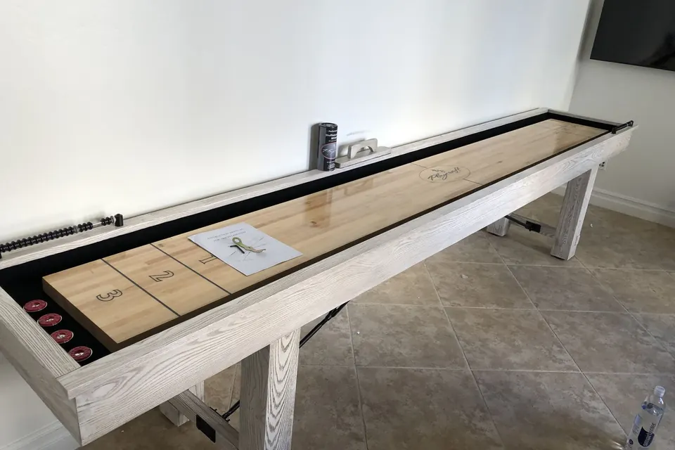 Assembled shuffleboard table in a game room